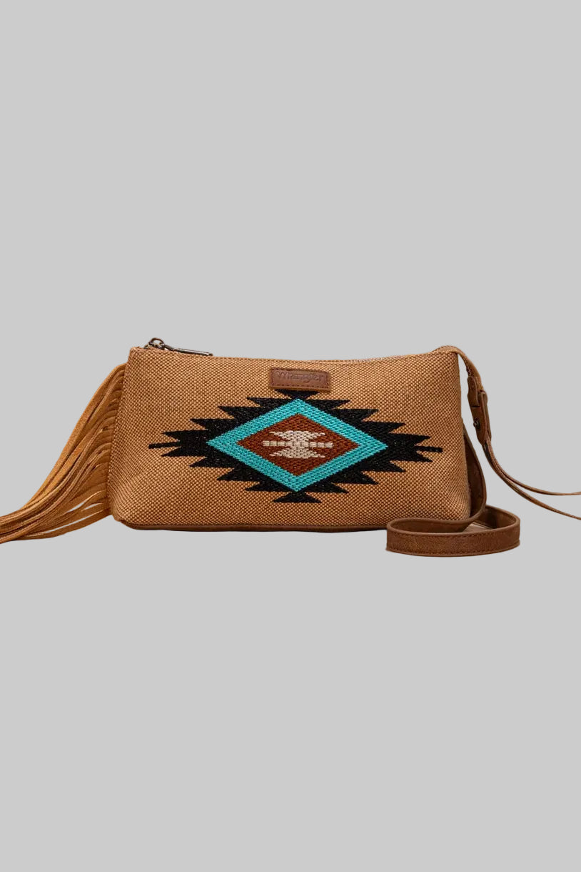 Trestles Clothing Company Aztec wristlet and crossbody bag in tan canvas with fringe, embroidery, and Wrangler logo.